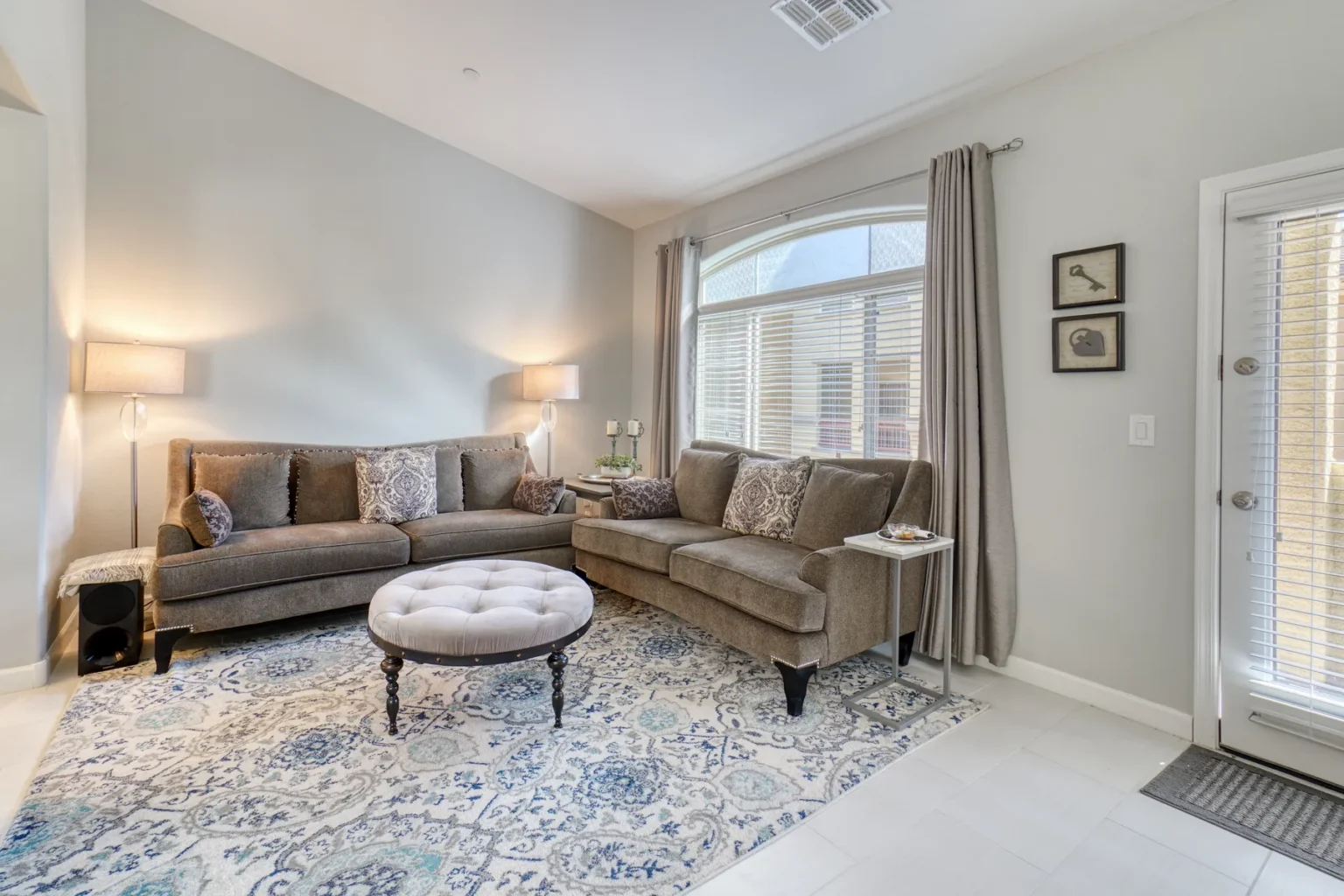 buyer step 02 living room Living room with a sectional sofa and patterned rug
