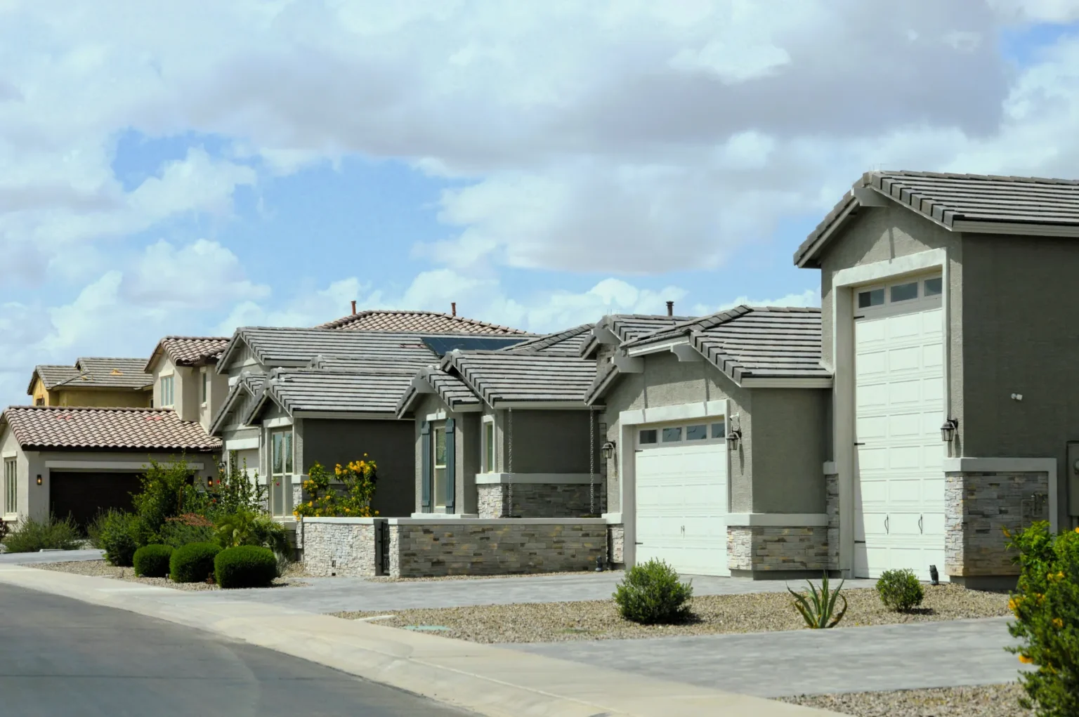buyer step 05 homes Row of newer two-story homes with desert landscaping