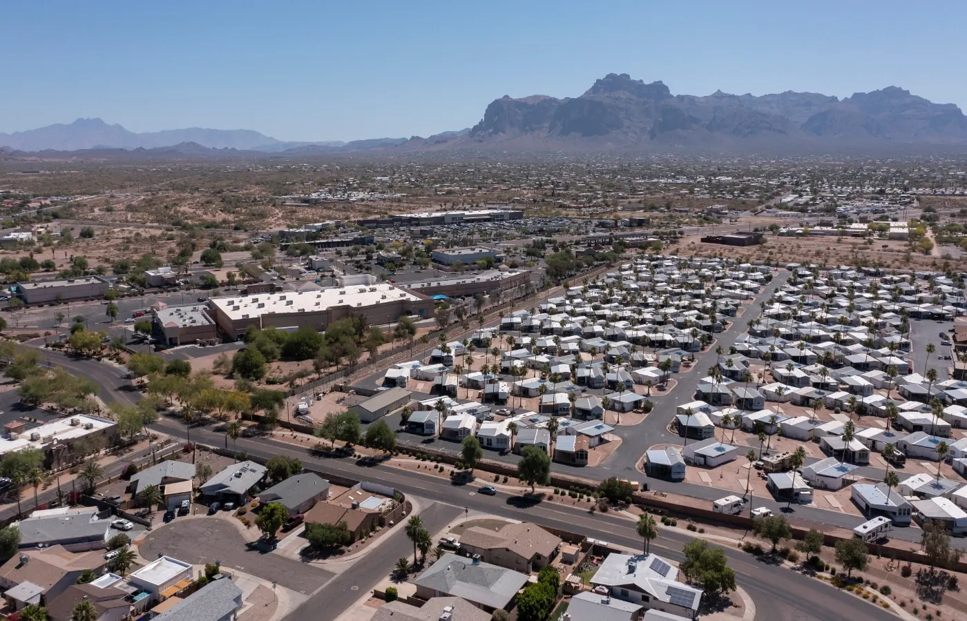 Aerial view of Apache Junction neighborhoods below the Superstition Mountains