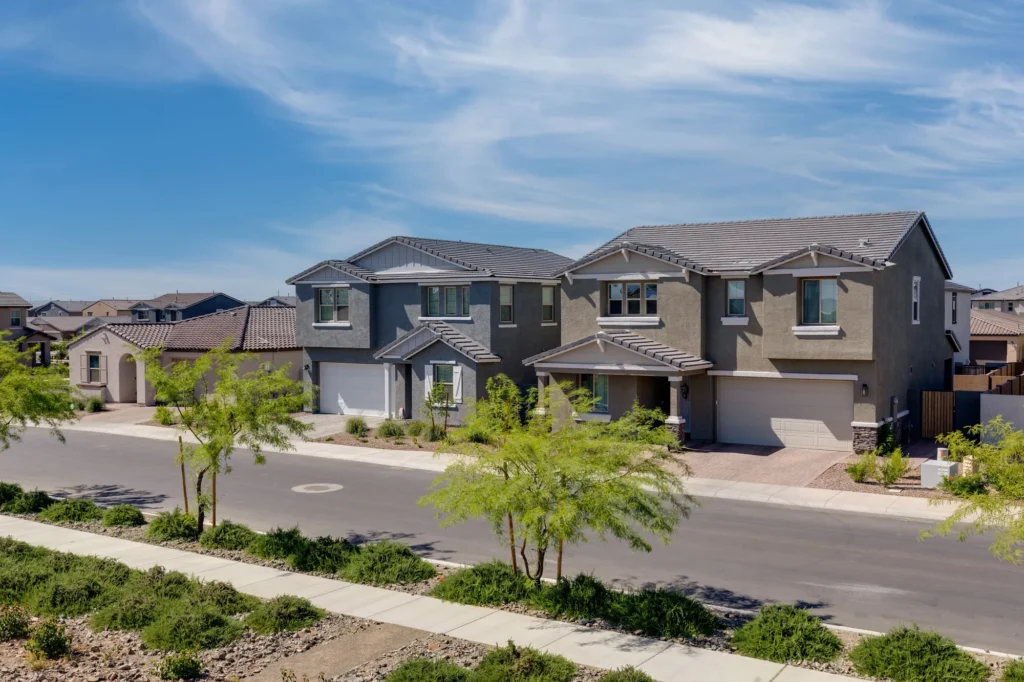 Newly built two-story homes on a landscaped street