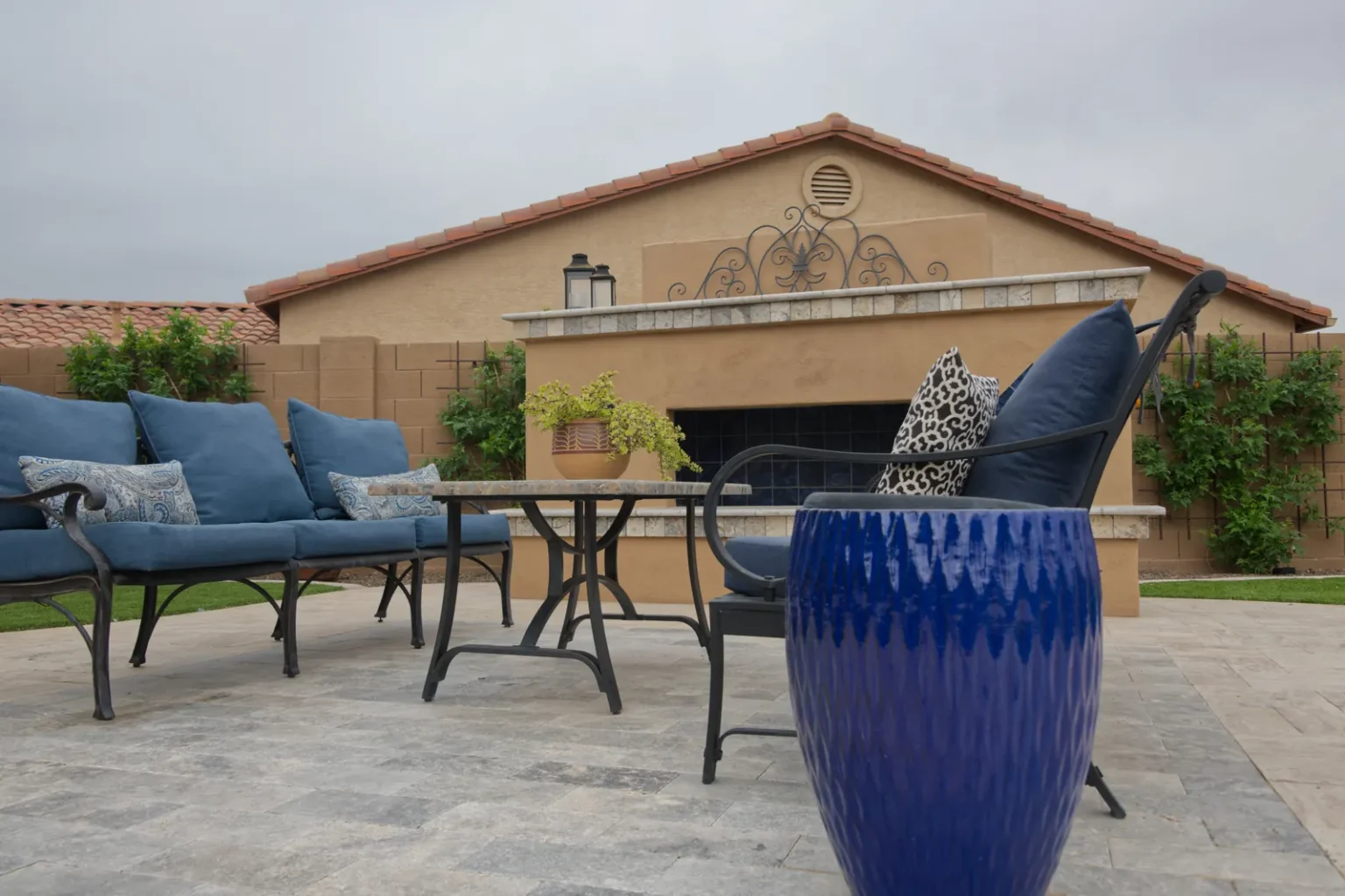 seller buyers meet your house Covered patio with blue cushioned seating and a cobalt planter